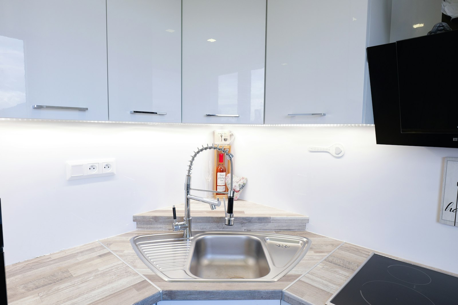 Plumber installing a new bathroom faucet and sink fixture