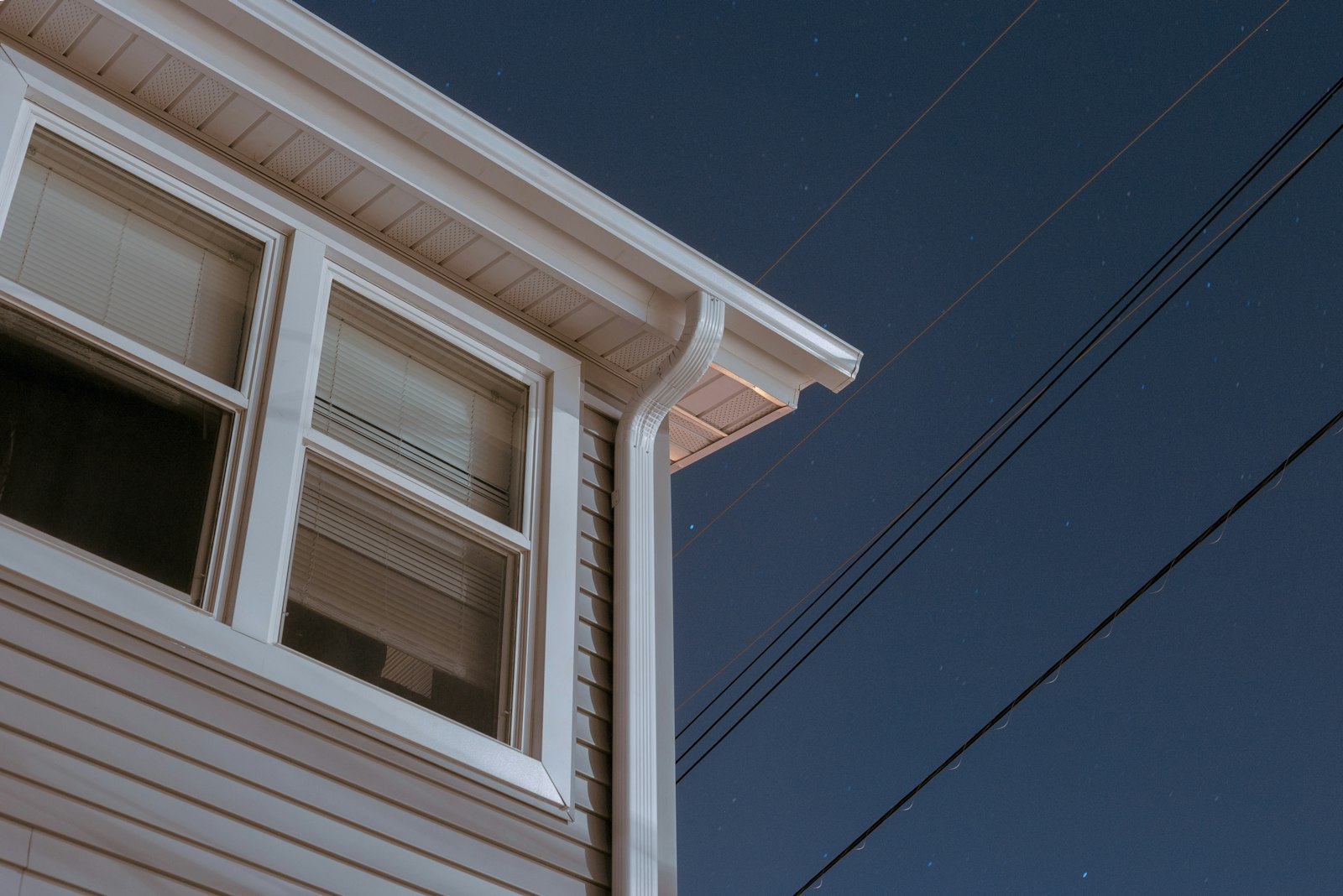 Seamless K-style aluminum gutter installation on a Long Island home